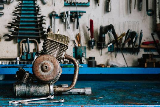 Motorbike engine on bench.