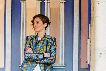 stylish woman standing in doorway