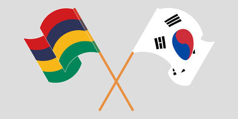 Crossed and waving flags of Mauritius and South Korea
