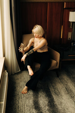 young blond woman with cellphone