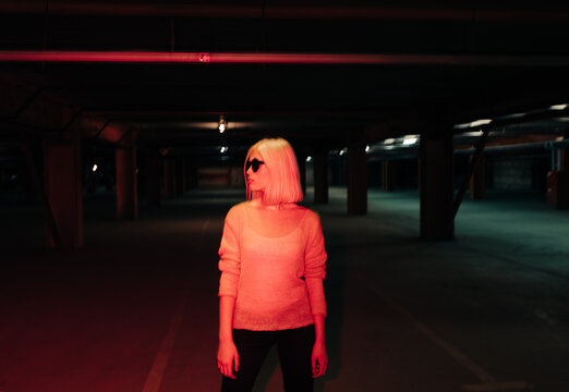 Young blond woman with round sunglasses