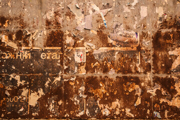 Texture background old rusty billboard for ads and advertisement with pieces of torn paper