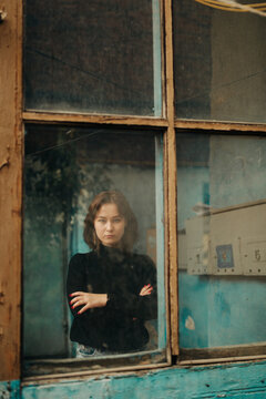 young woman inside a old house