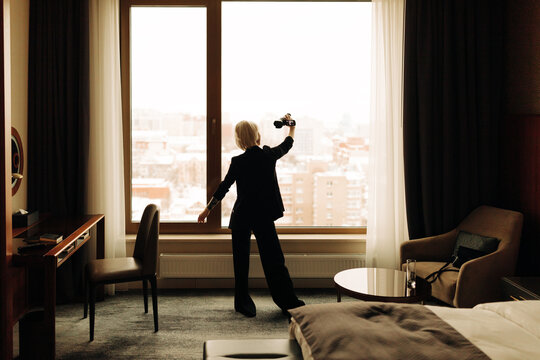 young blond woman with small camcorder