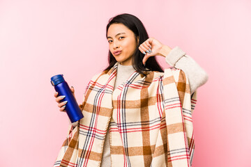 Young chinese woman doing a camping isolated on pink background biting fingernails, nervous and very anxious.