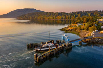 Overhead Aerial View of a Small Ferryboat docking on Lummi Island. The 21 car ferry services this...