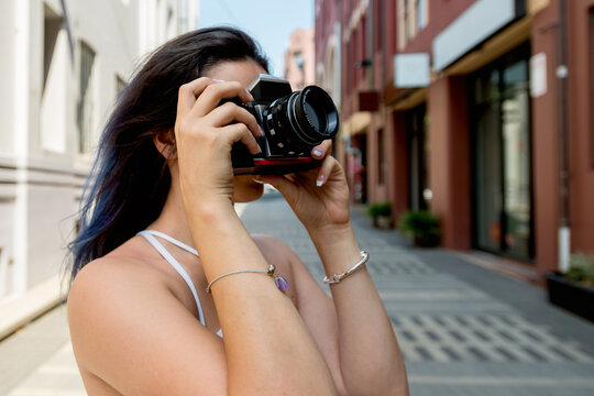 traveller taking a photo with film camera