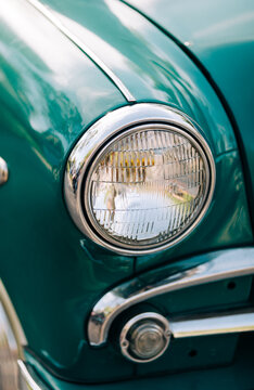 part of green vintage car