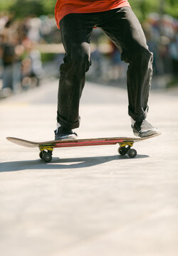 young man doing trick on skateboard .