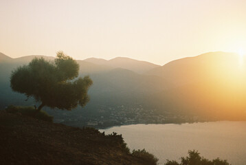 Sun sets over a bay in Cephalonia.