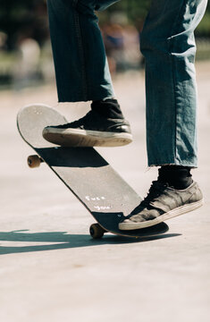 young man doing trick on skateboard .