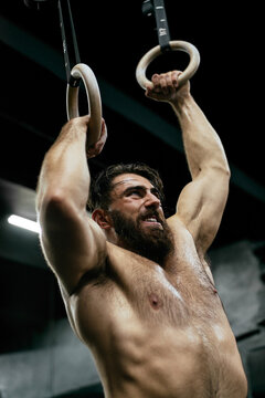 Handsome athlete gym training