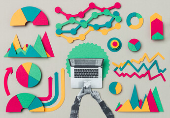 Female hands working on a laptop with a statistics papers