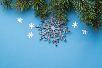 Christmas tree and decorations on color background