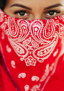 portrait of young woman with red headscarf