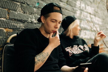 lesbian women smoking on the street