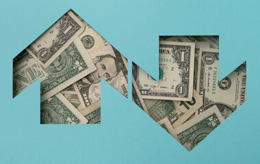 Arrow with dollar bills