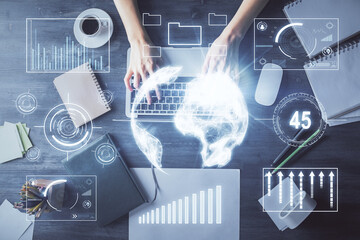 Multi exposure of woman hands working on computer and forex chart hologram drawing. Top View. Financial analysis concept.