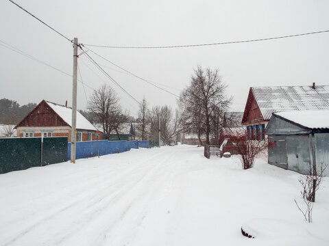 Rural street in winter in Russia