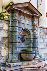 a spring flowing down from the mountain, clothed in a stone bed and flowing into a stone bowl from the wall of the Orthodox Macedonian Church of St. Florian. The water is always cold and delicious.
