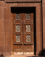 Facade of modern building. Old-fashioned brown front door.