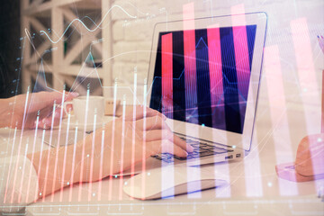 Fototapeta na wymiar Double exposure of woman hands typing on computer and forex chart hologram drawing. Stock market analysis concept.