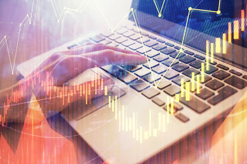 Double exposure of woman hands typing on computer and forex chart hologram drawing. Stock market analysis concept.