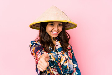 Young mixed race hispanic woman isolated smiling and raising thumb up