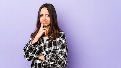 Young mixed race hispanic woman isolated unhappy looking in camera with sarcastic expression.