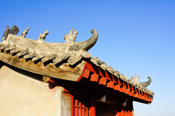Decorated roof of Buddhist temple on the city wall of old town of luoyang China