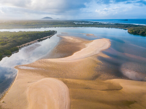Aerial view of mangroves and sandbars in a river delta