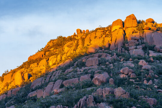 Golden sunlight hitting the tops of a rocky mountain ridge