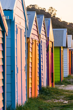 Looking along a row of colorful timber bathing boxes