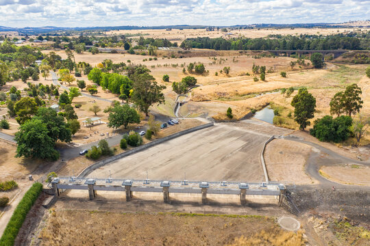 Aerial view of the dry concrete spillway of a reservoir