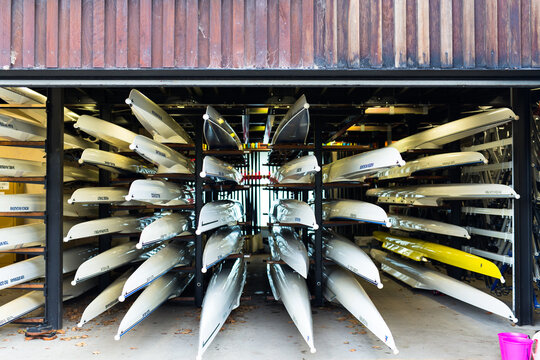 Rowing boats stacked in a boat house
