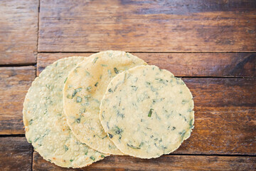 Mexican traditional handmade tortillas. Recently handmade corn tortillas on wooden table. Mexican food