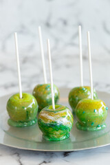 marbled green toffee candy apples on sticks