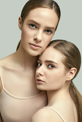 Two beautiful sensual young girls with clean fresh face skin