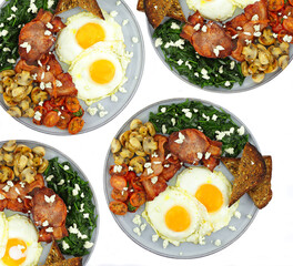 Fried eggs and bacon with a serve of spinach mushrooms and toast