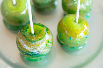 marbled green toffee candy apples on sticks