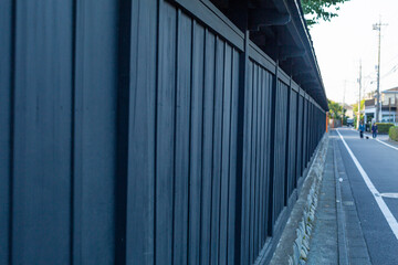 black wooden wall along side of  the road in early morning in countryside, tokyo, japan