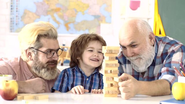 Father and son with grandfather was excited with playing game. Happiness mans family life style concept. Parenting childhood values weekend. Male multi generation portrait.