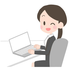 ノートパソコンを操作するスーツの女性