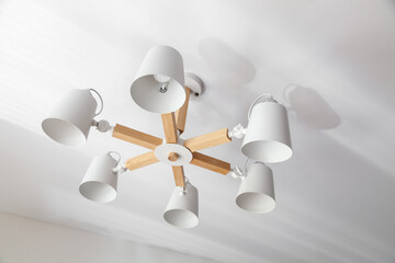 Wooden chandelier with five electric lamps and lampshades