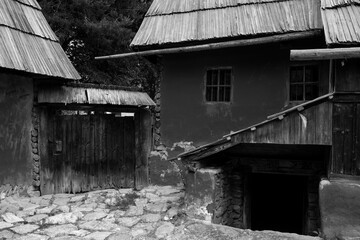 peasant house with thatched roof and tile built of clay and brick