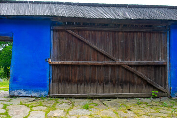 wooden door and window of the traditional wooden and brick house in the authentic village