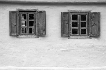 wooden door and window of the traditional wooden and brick house in the authentic village