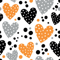 Seamless pattern with black and orange polka dot hearts.