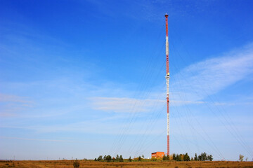 Cell tower stands in a field