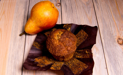 Cupcake, cake with red and yellow apples on a wooden table